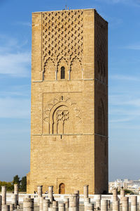 Hassan tower against blue sky