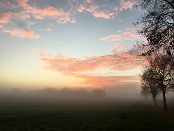 Scenic view of landscape against cloudy sky