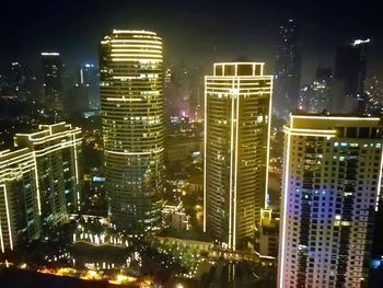 Illuminated skyscrapers at night