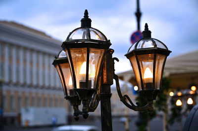 Close-up of illuminated street light against sky