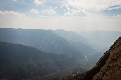 Misty mountain range covered with white mist