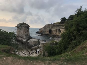 Castle by sea against sky