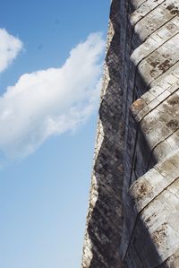 Low angle view of rock against sky