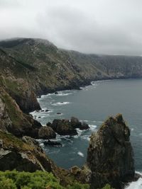 Scenic view of sea against cloudy sky