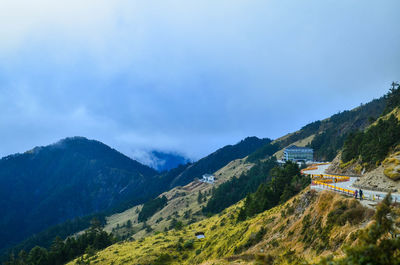 Scenic view of mountains against cloudy sky