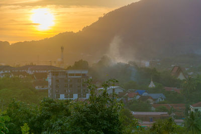 Scenic view of residential district against sky