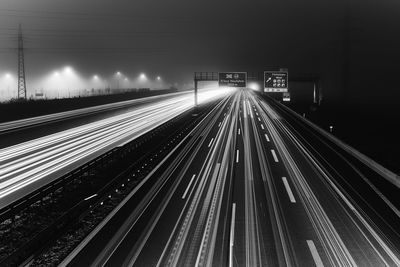 Light trails on railroad tracks at night
