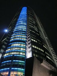 Low angle view of modern building at night