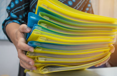 Close-up of person holding yellow food