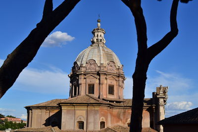 Low angle view of bell tower against sky