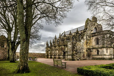 View of old building against cloudy sky