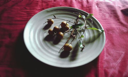 High angle view of fruit in plate on table