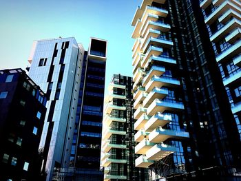 Low angle view of skyscrapers against clear sky