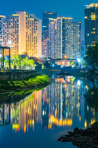 The view night cityscape around waduk kebon melati. jakarta, indonesia. long exposure.