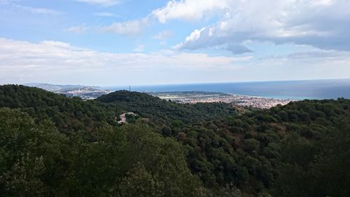 High angle view of calm sea against cloudy sky