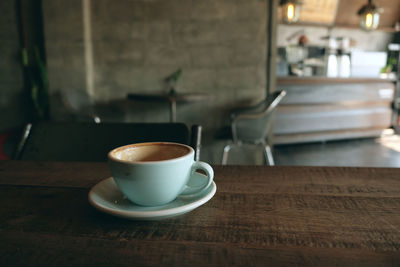 Close-up of coffee cup on table