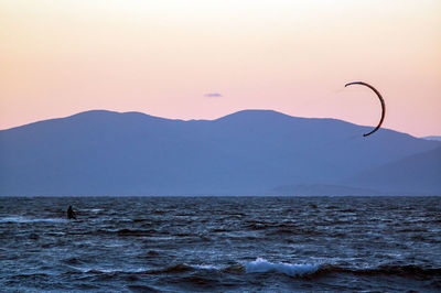 Scenic view of sea against clear sky during sunset