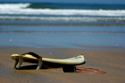 Deck chairs on sand at beach