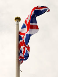 Low angle view of flag against sky