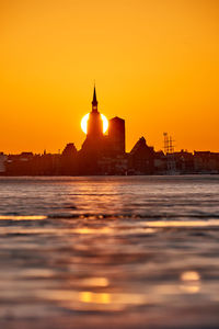 Silhouette of buildings during sunset