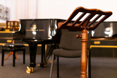 Close-up of empty chairs on table