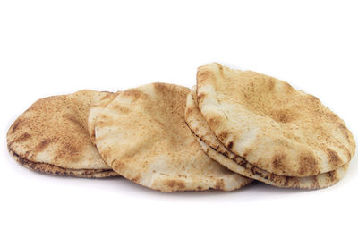 Close-up of bread against white background