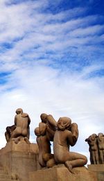 Low angle view of statue against sky