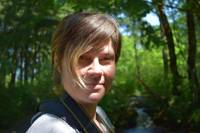 Portrait of young woman in forest