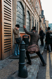 Men standing sculpture in city