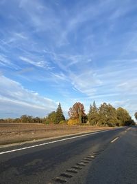 Empty road against sky