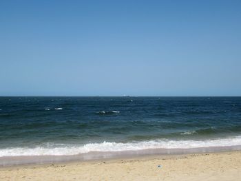 Scenic view of sea against clear sky