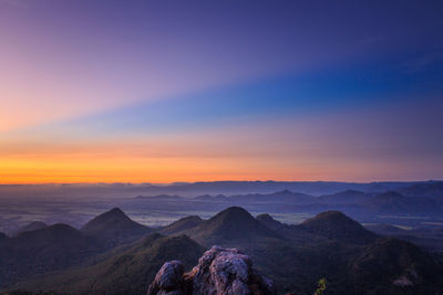 Scenic view of mountain against cloudy sky