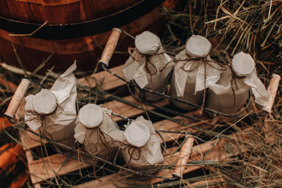 Milk bottles mockups on the hay. autumn farm fair market. rustic style. healthy natural products