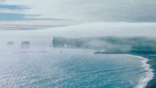 Scenic view of sea against sky during winter