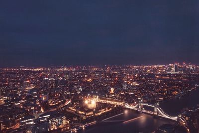 High angle view of illuminated buildings in city at night