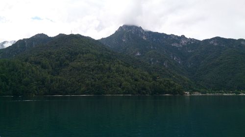 Scenic view of lake with mountains in background