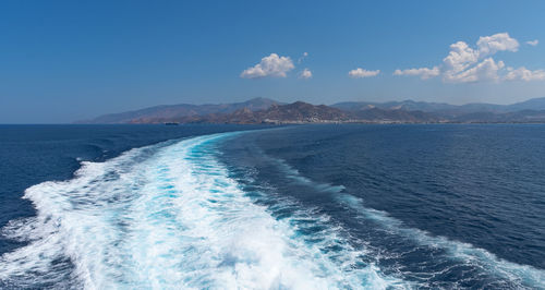 Scenic view of sea against blue sky