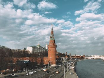 View of city street and buildings against sky
