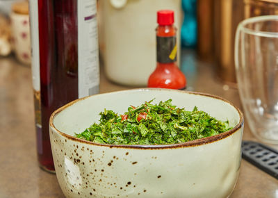 Close-up of salad in glass on table