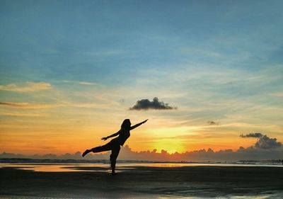 Silhouette of a woman on beach