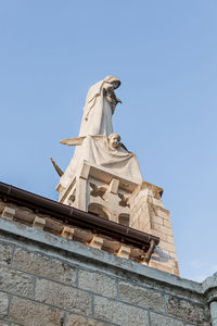 Low angle view of statue against clear sky