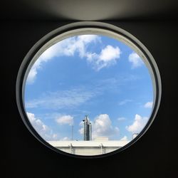 Blue sky view from a circle window