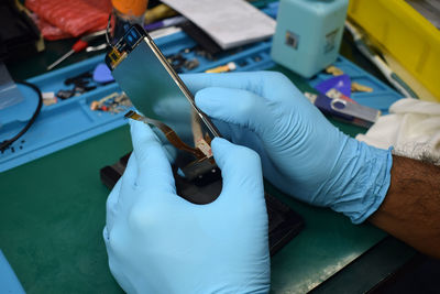 High angle view of people working on table