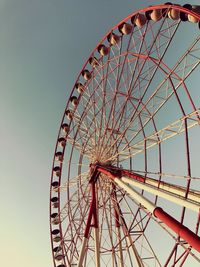 Low angle view of ferris wheel against sky