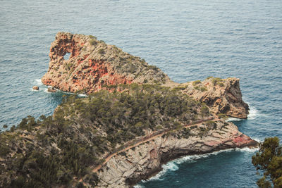High angle view of rock formations in sea