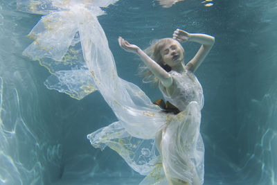 Woman swimming in sea