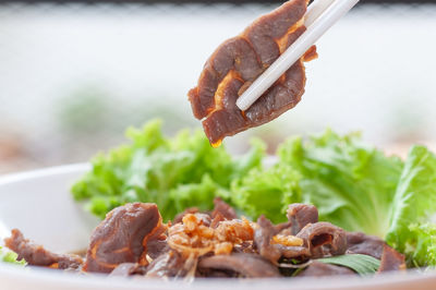 Close-up of meat on barbecue grill