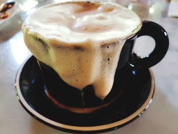 Close-up of cappuccino on table