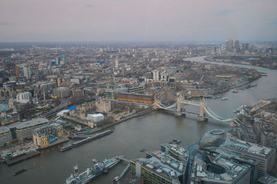 High angle view of river amidst buildings in city