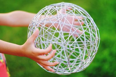 Close-up of hand holding ball